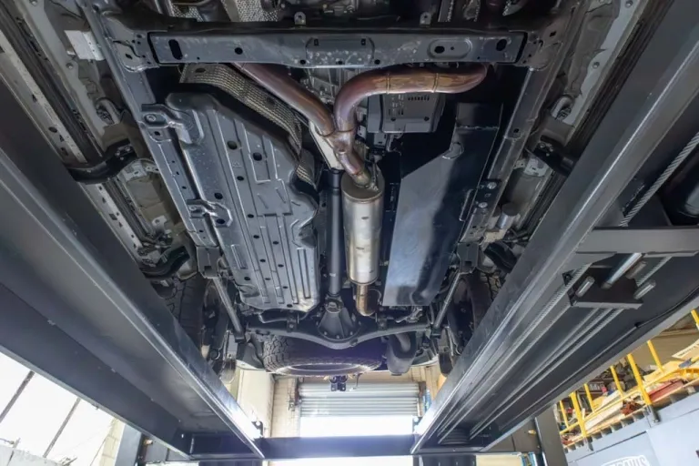 Underbody view of Lexus GX550 showing the factory layout before auxiliary tank installation, highlighting the passenger-side mounting area
