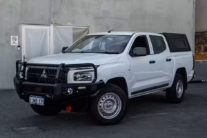 Alu-Cab Contour Canopy fitted to a Mitsubishi MV Triton with durable aluminium construction and integrated roof rails